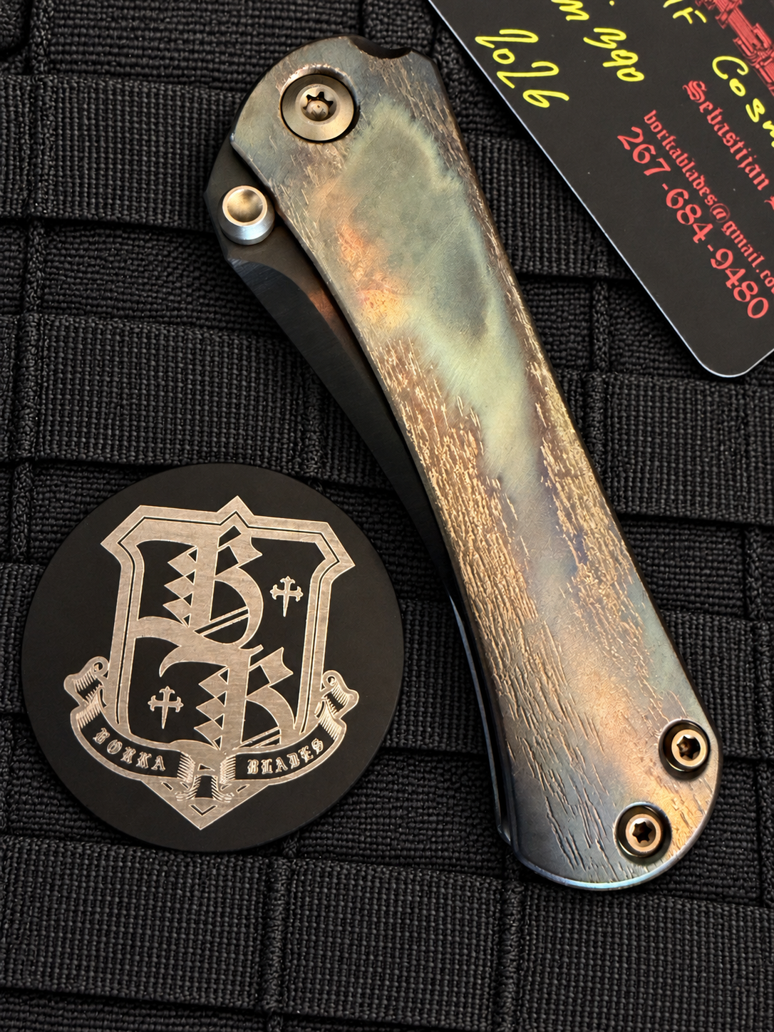 Close-up of Borka Blades SBHF Cosmic DLC titanium handle showing unique bronze charcoal distressed finish and premium titanium hardware.