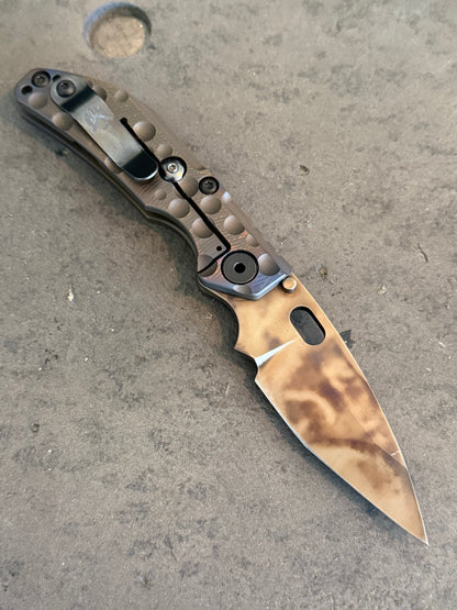Duane Dwyer BBN-M Hissatsu showing cratered titanium frame lock, black engraved pocket clip and antique thermal finished PD1 blade.