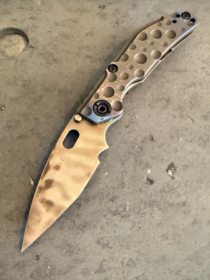 Duane Dwyer Custom Goods BBN-M Crater Hissatsu PD1 folding knife with Antique Bronze cratered titanium handle and thermal finished blade.