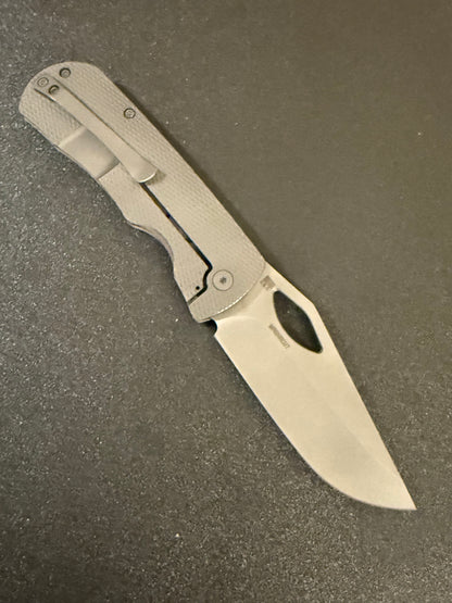 McNees Dixon 3.75 CPM MagnaCut blade showing titanium frame lock and pocket clip side