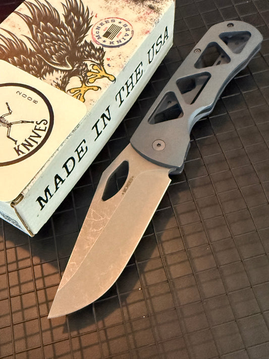McNees Dixon 3.75 skeletonized blue titanium frame lock knife with stonewashed blade and titanium pocket clip