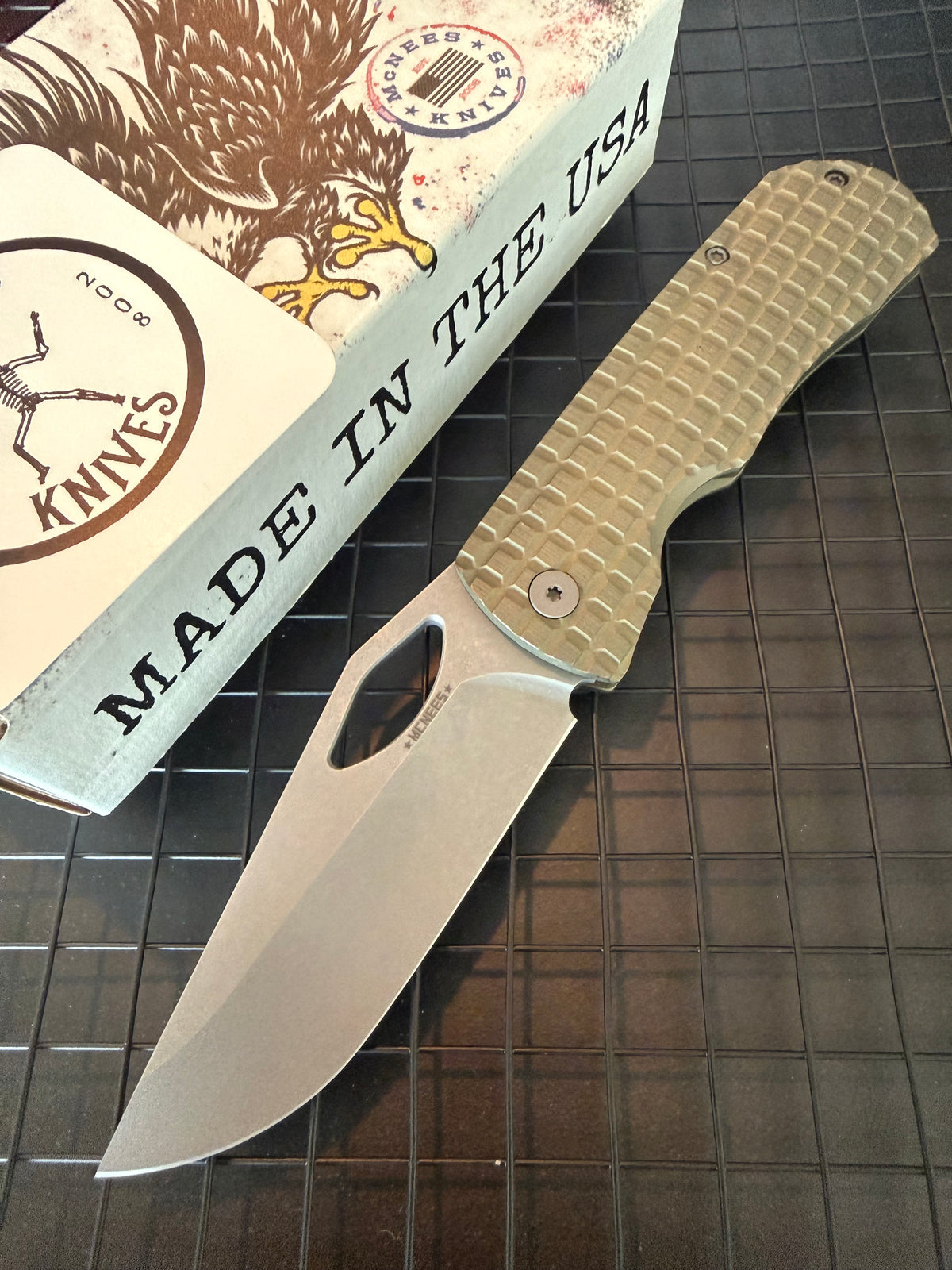 McNees Little Dixon 3.25 folding knife with stonewashed drop point blade and green FRAG milled titanium handle with bronze hardware