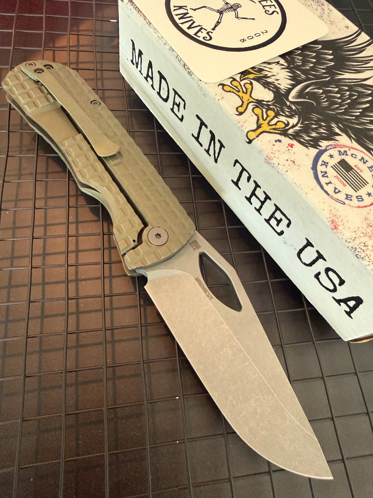 McNees Little Dixon green FRAG titanium frame lock knife with bronze hardware, stonewashed blade and titanium pocket clip