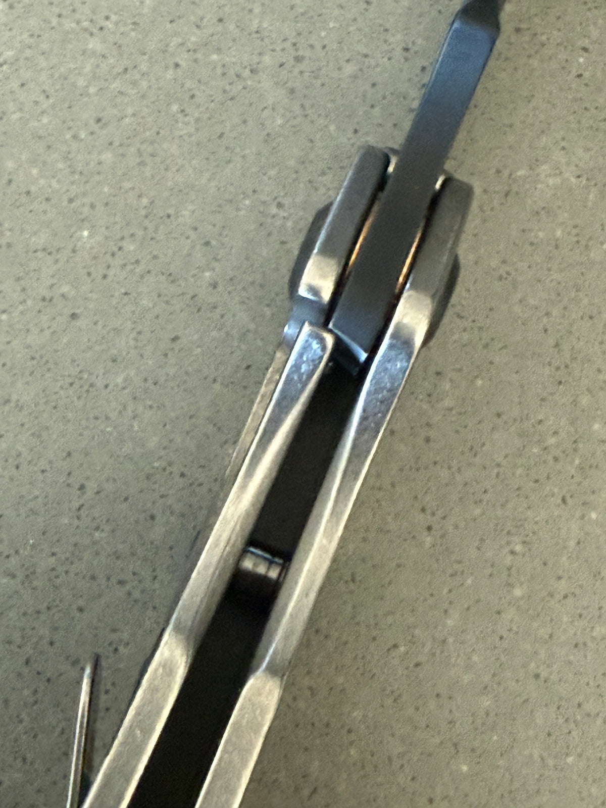 Mick Strider SnG Battleship MagnaCut knife showing titanium frame lock, matching camouflage pocket clip and blacked-out hardware