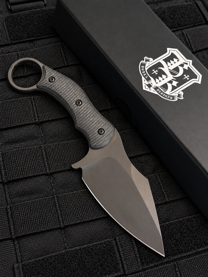Reverse side of Borka Blades SRambit M390 fixed blade showing black PVD blade, sculpted carbon fiber handle and integrated finger ring.