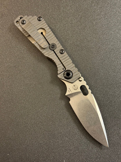 Strider Classic Line MagnaCut spearpoint knife with Strider-striped titanium frame lock and pocket clip