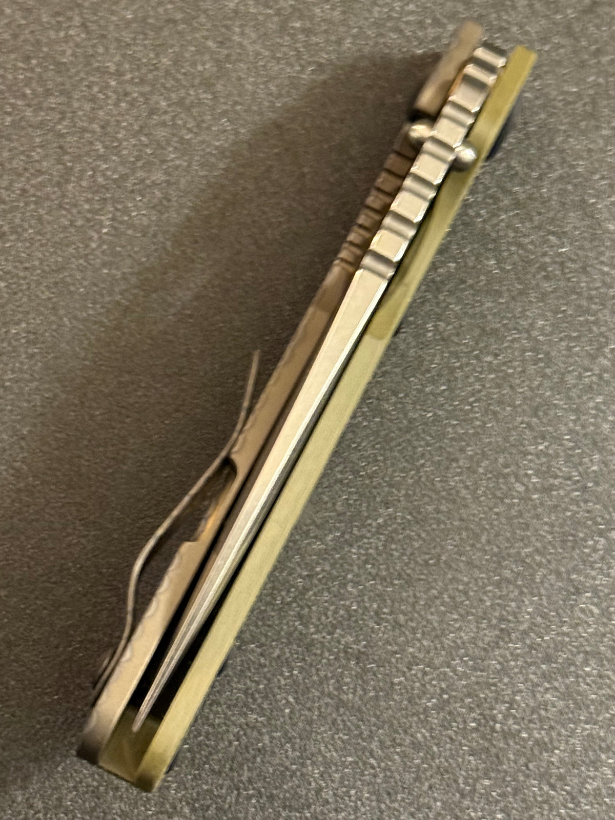 Strider Classic Line folding knife showing blade thickness, spine jimping and G10 handle construction