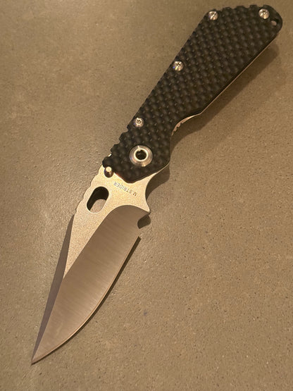 Strider SMF DGG Double Gunner Grip with hand-ground satin Bowie S30V blade and textured black G10 presentation side.